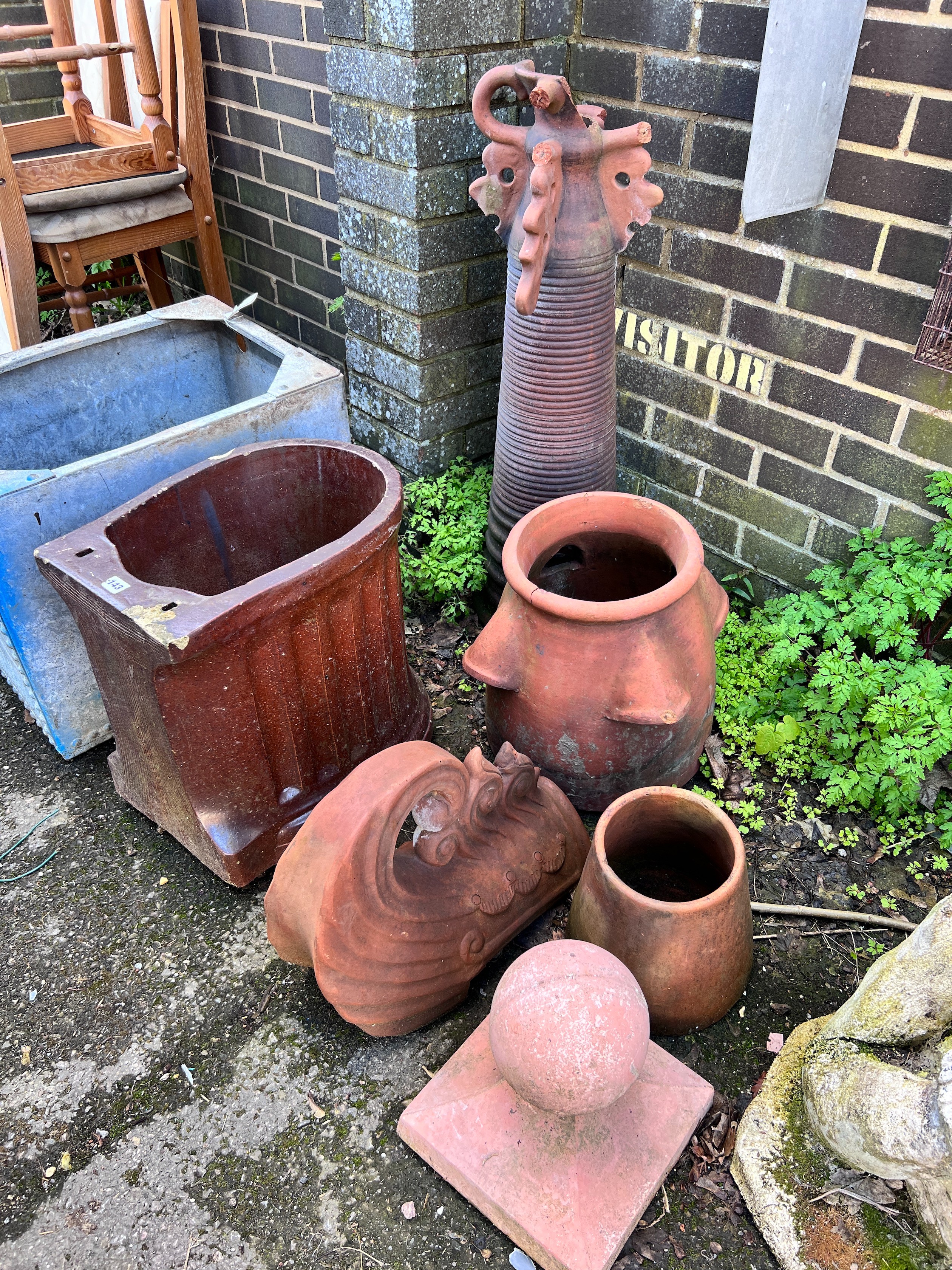 Six assorted terracotta and earthenware planters and ornaments *Please note the sale commences at 9am.